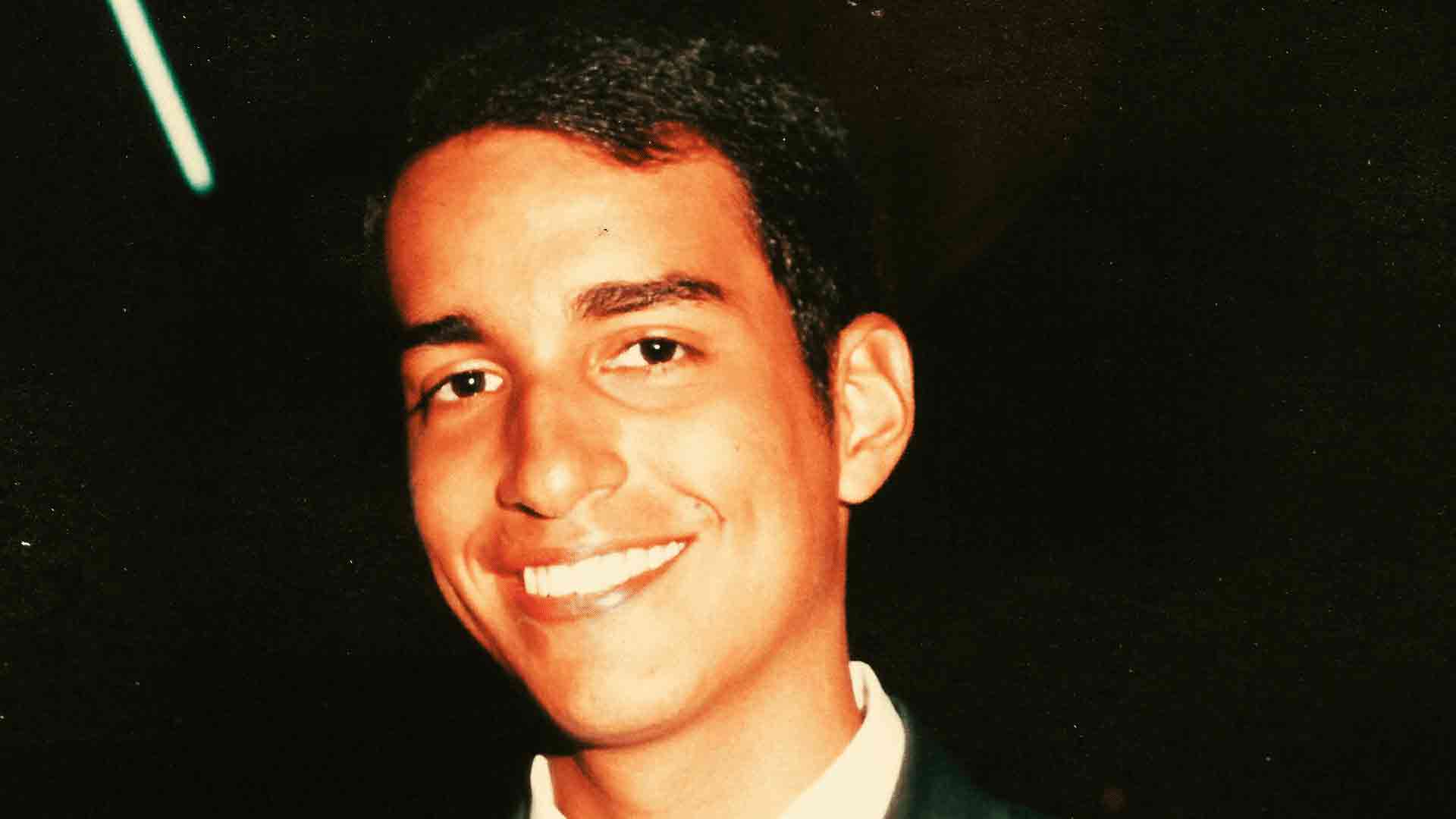 Raúl smiling during High School graduation